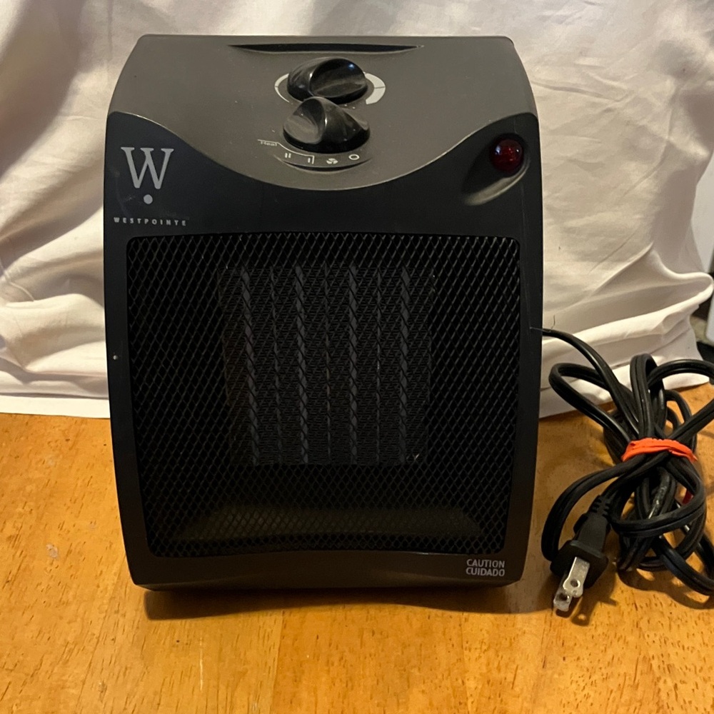 Like new ( used a couple times ) awesome mini electric heater with 6 ft plug. by
